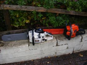 An electric chainsaw together with one other