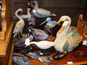 A quantity of ornamental wooden ducks and birds