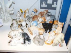 A quantity of cat ornaments