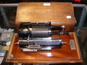 An unusual Britannic Guy's calculating machine in