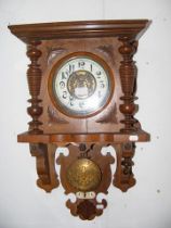 An antique wall clock with striking movement and v