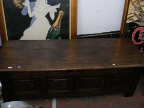 A period carved oak panelled coffer - 176cm long