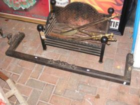 A cast iron fire grate, together with fender and t