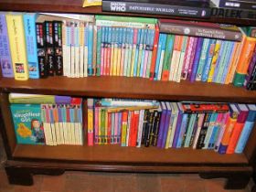 Two shelves of mostly Enid Blyton books