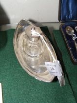 A silver boat shaped inkwell with Birmingham hallm