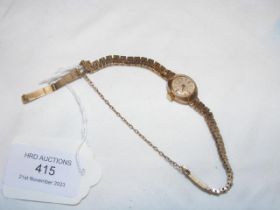 A ladies Accurist wrist watch in 9ct gold case and