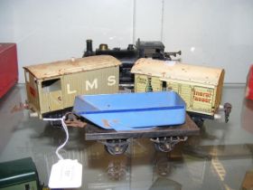 An old Hornby 0 gauge locomotive, together with tw