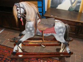An antique rocking horse - 115cm long