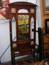 A late Victorian hall stand with tiled and mirrore