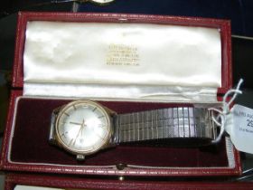 A gents 9ct gold Garrard Automatic wrist watch wit