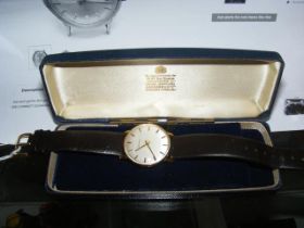 A gents 9ct gold Garrard manual wind wrist watch i