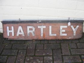 An old 'Hartley' wooden railway station sign