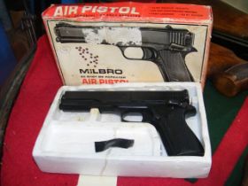 A Milbro 20 shot BB repeater air pistol with box