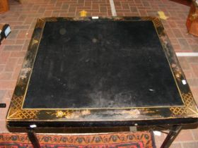 A Japanned foldaway card table