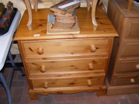 A three drawer pine chest
