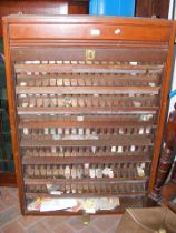An old tambour fronter railway ticket cabinet, con