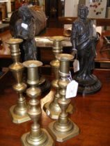 A pair of 33cm high bronze figures, together with