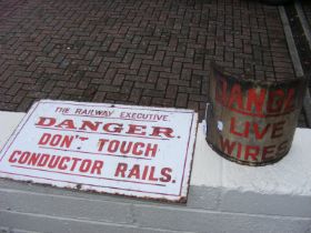 An old enamel railway sign together one other