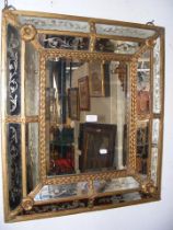 A cushion shaped antique wall mirror - 70cm x 60cm