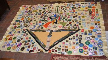 A scout campfire blanket decorated many scout badg