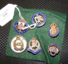 Various military and other lapel badges, including