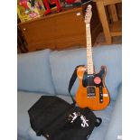 A Fender electric guitar, together with carrying c