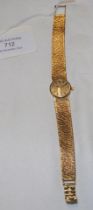 A ladies 9ct gold Omega wrist watch with integral