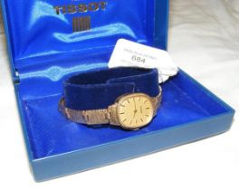 A ladies 9ct Tissot wrist watch with original box