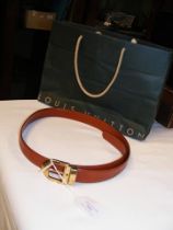 A Louis Vuitton leather belt with original bag