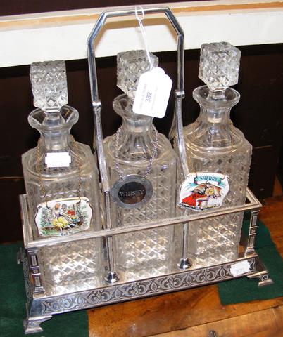 A three bottled silver plated tantalus