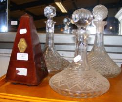 Three cut glass ship's decanters, together with a