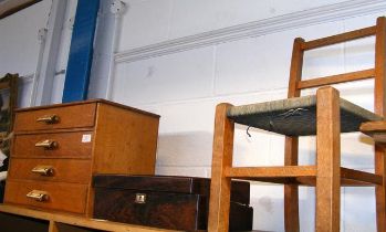 A child's chair, shoelace box and writing slope