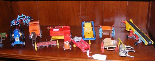 A quantity of vintage farmyard machinery toys