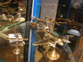Trench Art - Five fashioned brass fighter planes -