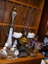 A selection of oil and electric lamps, etc.