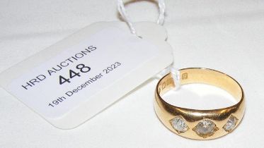 A three stone stone diamond ring in 18ct setting