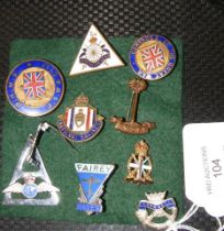 Nine assorted military and other lapel badges, inc