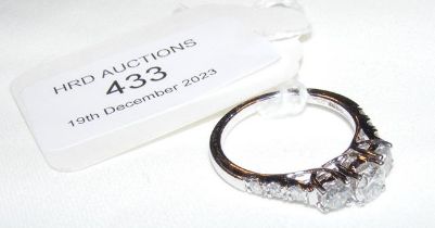 A 9ct white gold three stone diamond ring with dia