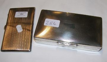 A silver cigarette case together with a silver pla