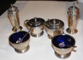 A pair of silver mustard pots, pepperettes and tab