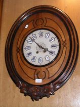 A 19th century French wall clock in decorative sur