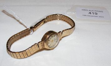 A 9ct gold ladies wrist watch with 9ct strap