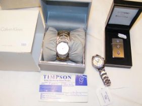 A ladies wrist watch together with others and a bo