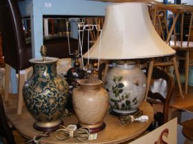 Four table lamps of varying shape and size