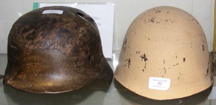 A WWII German M40 helmet with bullet hole