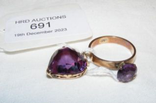 An amethyst ring in gold setting together with mat