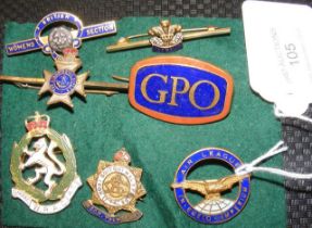 Seven assorted lapel badges and pins, including Th