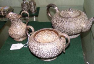 A three piece Indian silver tea set, marked O.M fo