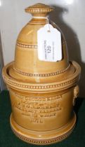 An unusual pottery jar and cover - the front inscr