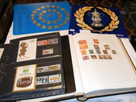 An album containing collectable GB stamps, togethe